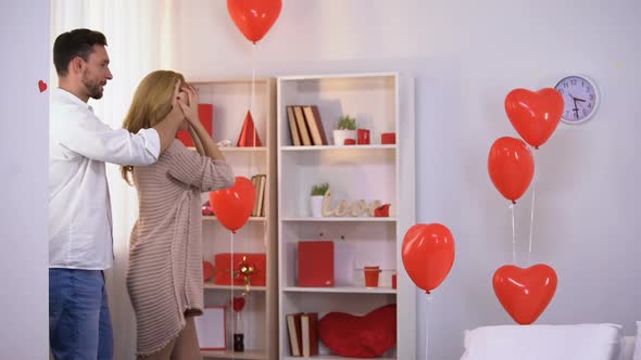 Husband Preparing Pleasant Surprise for Happy Wife, Tender Trustful Relations