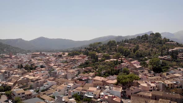 AERIAL: Balearic city on the hills with old architecture in mallorca