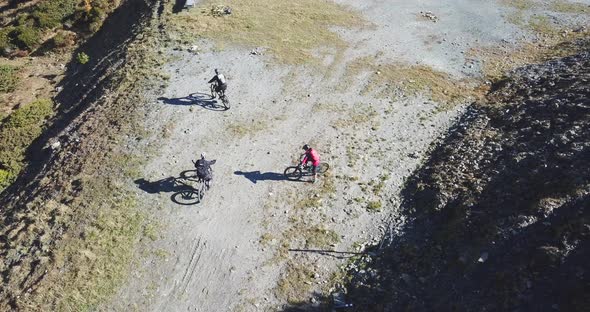 Aerial drone view of a group of mountain bikers on a singletrack trail