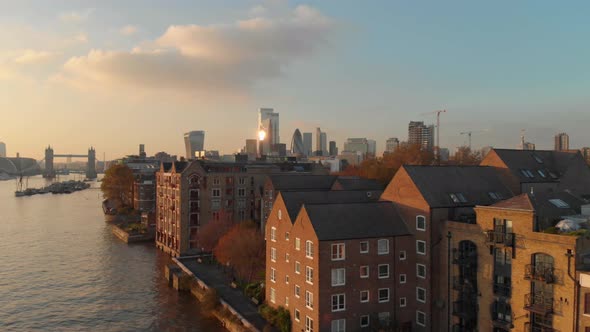 Establishing Crane Drone shot over London residential buildings towards city centre sunset