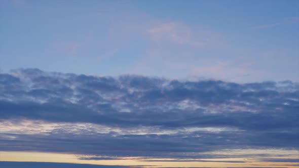 Time lapse of beautiful scenic dark blueing clouds after the sunset, medium shot