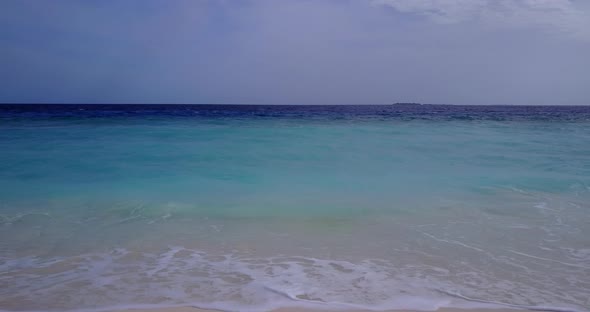 Luxury overhead island view of a white sandy paradise beach and aqua blue ocean background in colorf