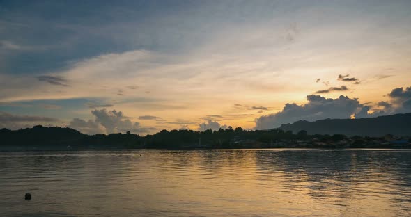Time lapse sunrise colorful sky over Bandaneira village Indonesia Banda Islands