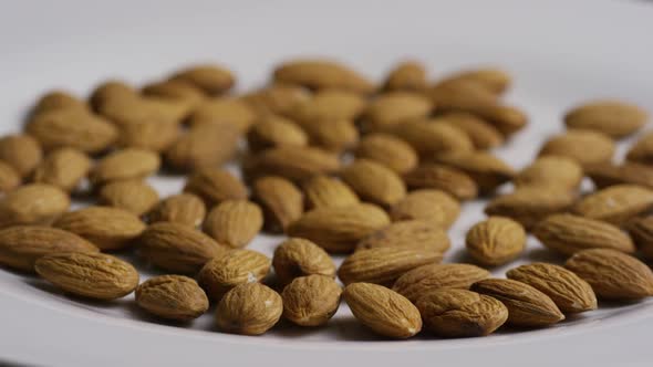 Cinematic, rotating shot of almonds on a white surface - ALMONDS 011