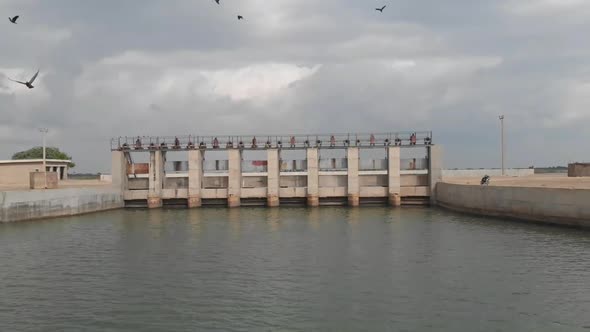 Aerial Dolly Back View Of Barrage Gate In Sindh Pakistan With Overcast Skies