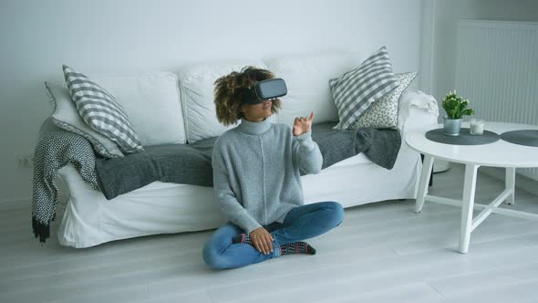 Woman in VR Glasses at Home