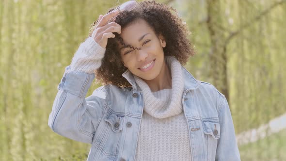 Spring or Sunny Autumn Outdoor Portrait of Beautiful Mixed Race Young Woman