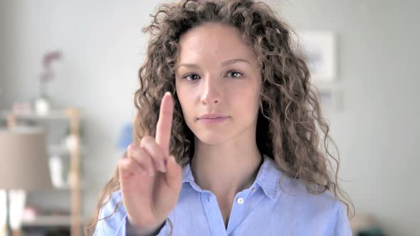 No, Curly Hair Woman Rejecting Offer by Waving Finger