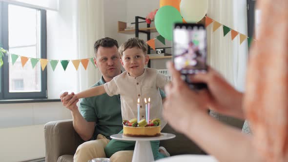 Family with Birthday Cake Photographing at Home