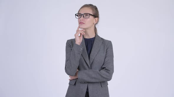 Young Happy Businesswoman with Eyeglasses Thinking