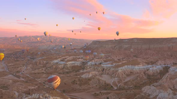 Aerial Drone View Pink Dawn in Cappadocia in the Rose Valley with Views of the Hills and Colorful