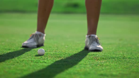 Woman Legs Play Golf Game Match on Grass Course