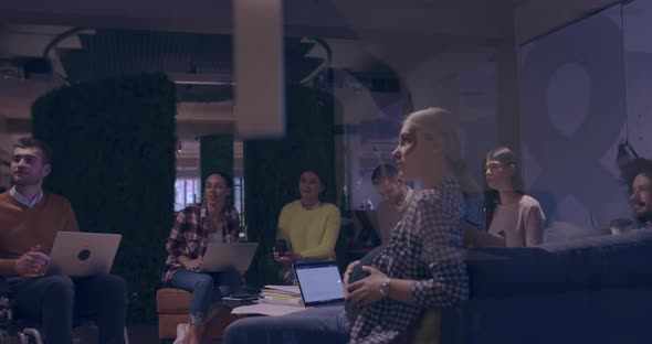 Businesswoman in Wheelchair Having Business Meeting with Team at Modern Office