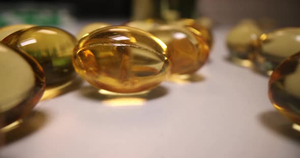 Fish Oil Capsule or Yellow Oil Vitamin Omega 3 Closeup