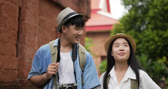 Couple hand together while visiting at ancient temple