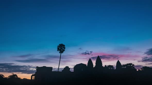 099483896 Sunrise Time Lapse Angkor Wat main facade silhouette. World famous temple in Cambodia