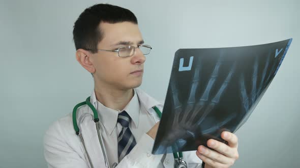 Doctor Looks At The X Ray In A Modern Hospital