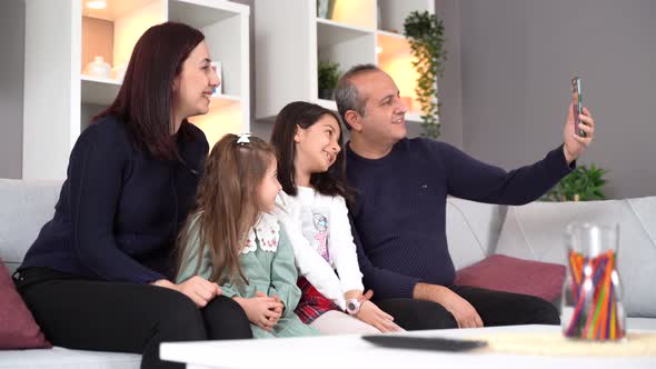 Family video chat with children. alt