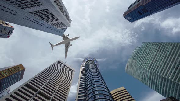 Airplane flight over the business center of skyscrapers.