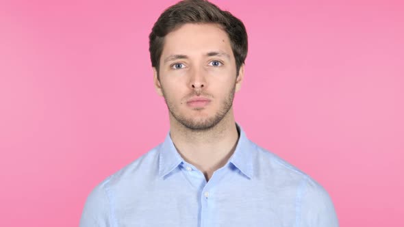 Young Man Isolated on Pink Background