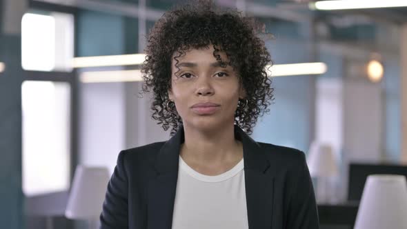 Portrait of Serious African Businesswoman Saying No with Finger Sign