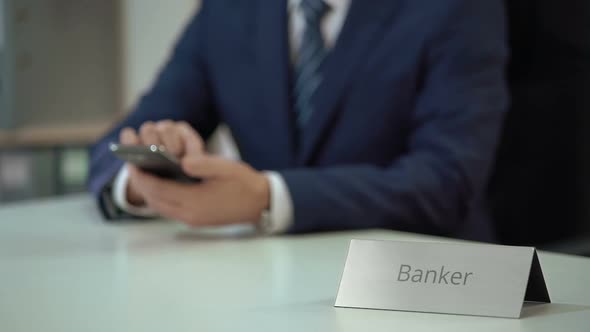 Male Banker Typing Message on Smartphone, Scrolling and Zooming Pages on Screen