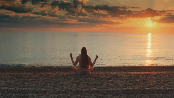 Girl Meditating on the Seashore