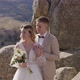 Happy Newlyweds Hugging on Top of the Mountain - VideoHive Item for Sale