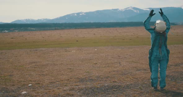 Female Astronaut Looking Towards Sun