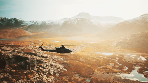 Slow Motion Vietnam War Era Helicopter in Mountains