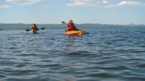 Couple of Tourists on Kayaks