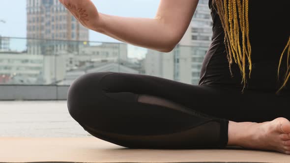 Woman Practices Hand Yoga Mudra Outdoors