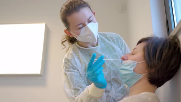 Medical Nurse in Gloves and Mask Test for Suspected Coronavirus Diagnosis