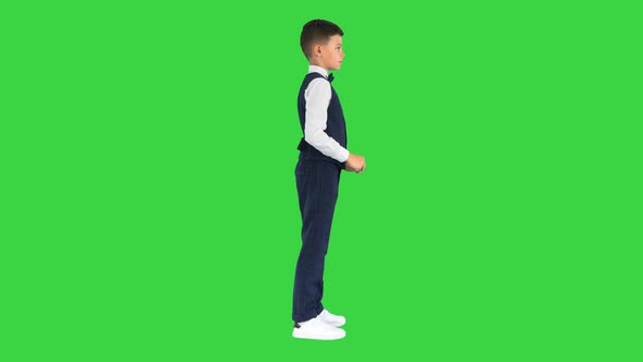 School Boy Touching Virtual Screen on a Green Screen Chroma Key