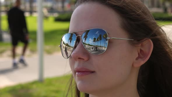Young Pretty Woman Enjoys the Sun of Miami Beach