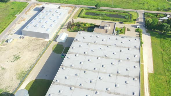 Aerial view of goods warehouse. Logistics center in industrial city zone from above. Aerial view of