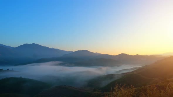 4K : Colorful sunrise over mountains tops in thailand