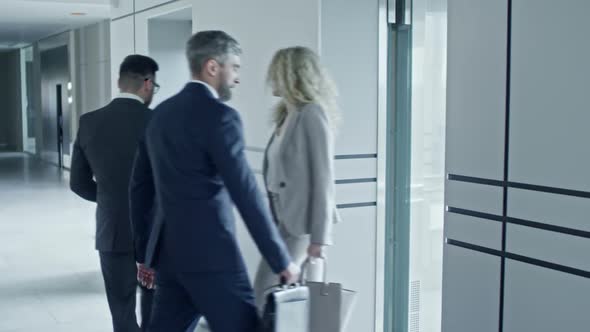 Businessman Entering Elevator