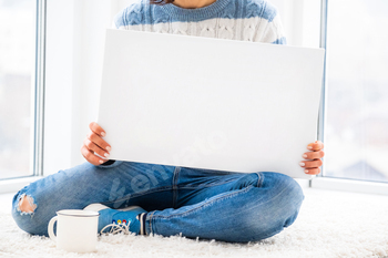 Girl holding white canvas