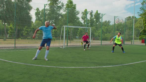Soccer Player Heading Ball Scoring Goal on Pitch After Corner Kick
