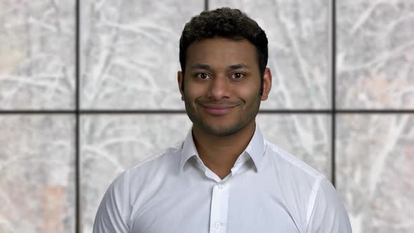 Close Up Smiling Indian Businessman Looking at Camera