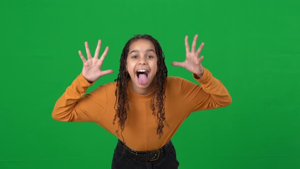 Laughing African American Teen Girl Grimacing Gesturing on Green Screen Mocking