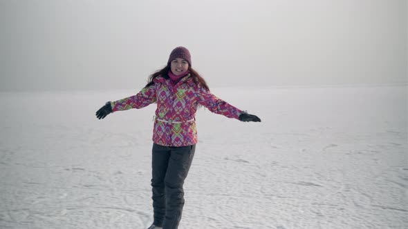 4K Girl ice skating on frozen lake