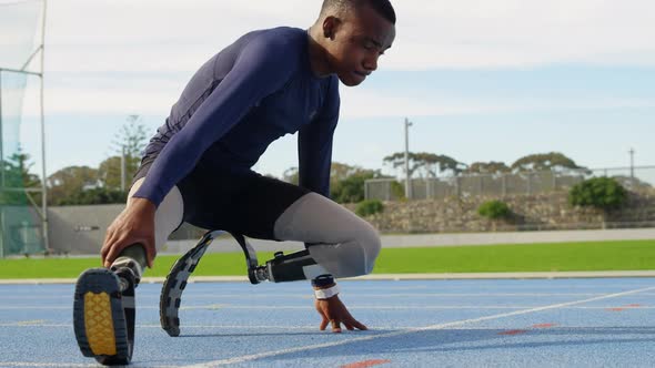 Disabled athletic exercising on a running track 4k