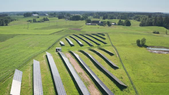 Drone Flight Over Solar Panels in Countryside