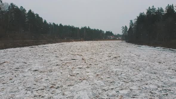 Aerial Dron Shot of the Huge Ice Loads Drift in the River Ogre, Latvia. 4K Video