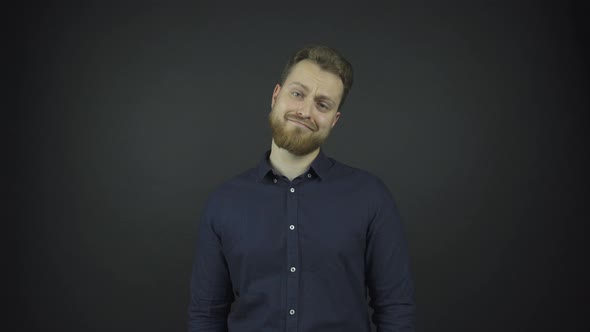 Happy Guy with Beard Talks and Laughs Under Bright Light