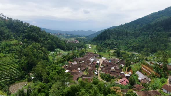 Picturesque village Sutopati located in valley between hills on Java aerial view