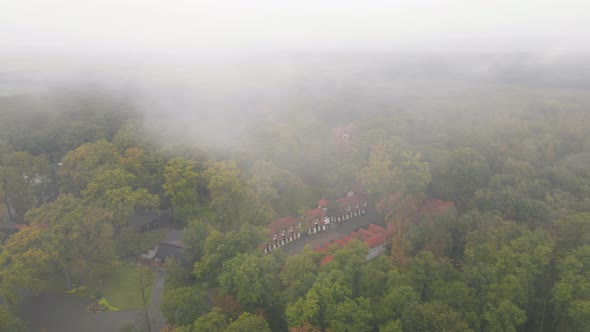 Hotel Houses in the Woods on a Foggy Gloomy Day