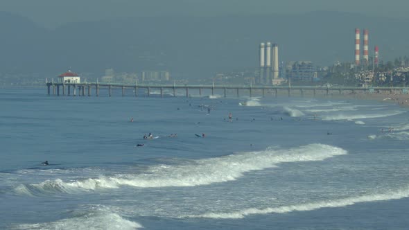 The Manhattan Beach Pier in California extends into the Pacific Ocean.